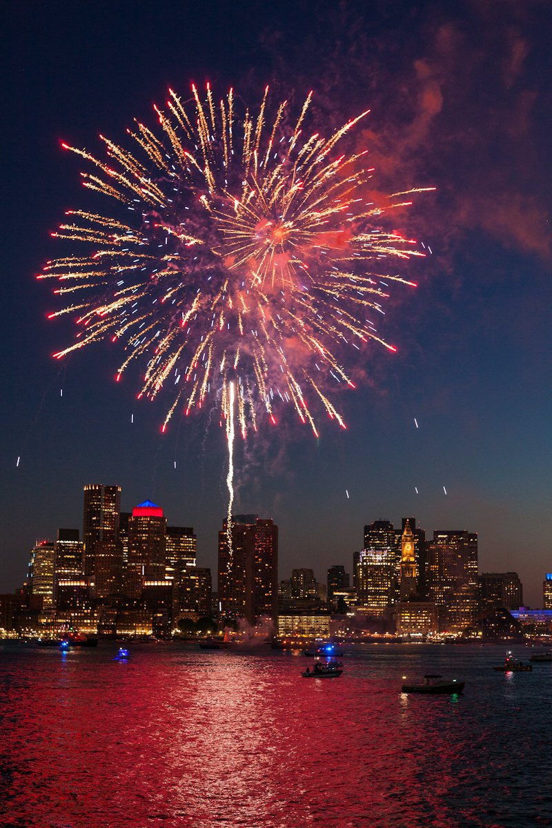 Fireworks over the Boston skyline at night